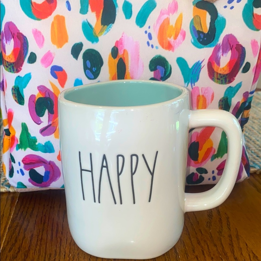 Rae Dunn Happy Mug with flower design and light teal  interior